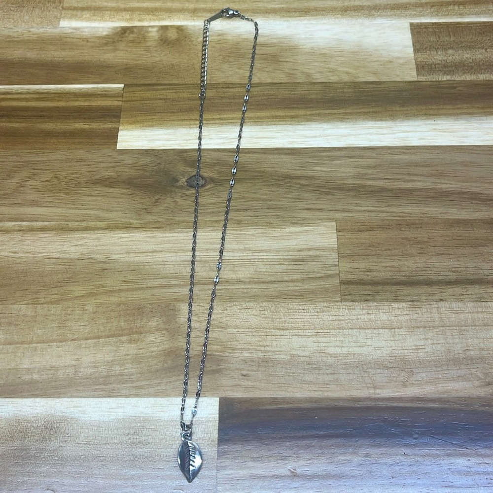 silver necklace with leaf charm
